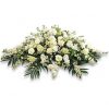 Cojín fúnebre con flores surtidas de la temporada.